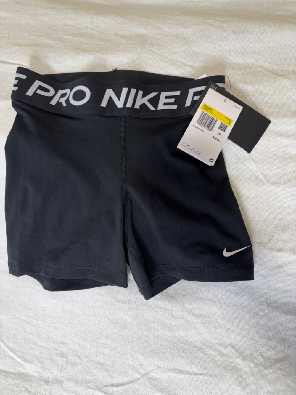 Nike Black Woman’s Training Compression Shorts with White Swoosh